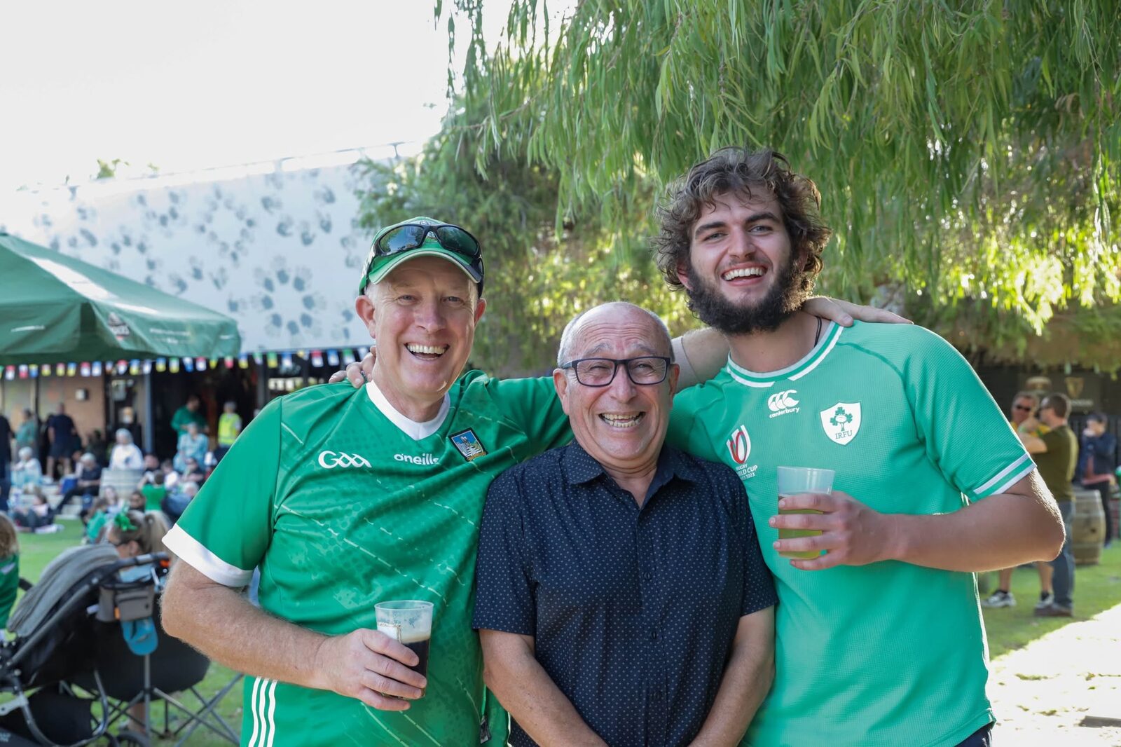Three men in Ireland jerseys at the festival